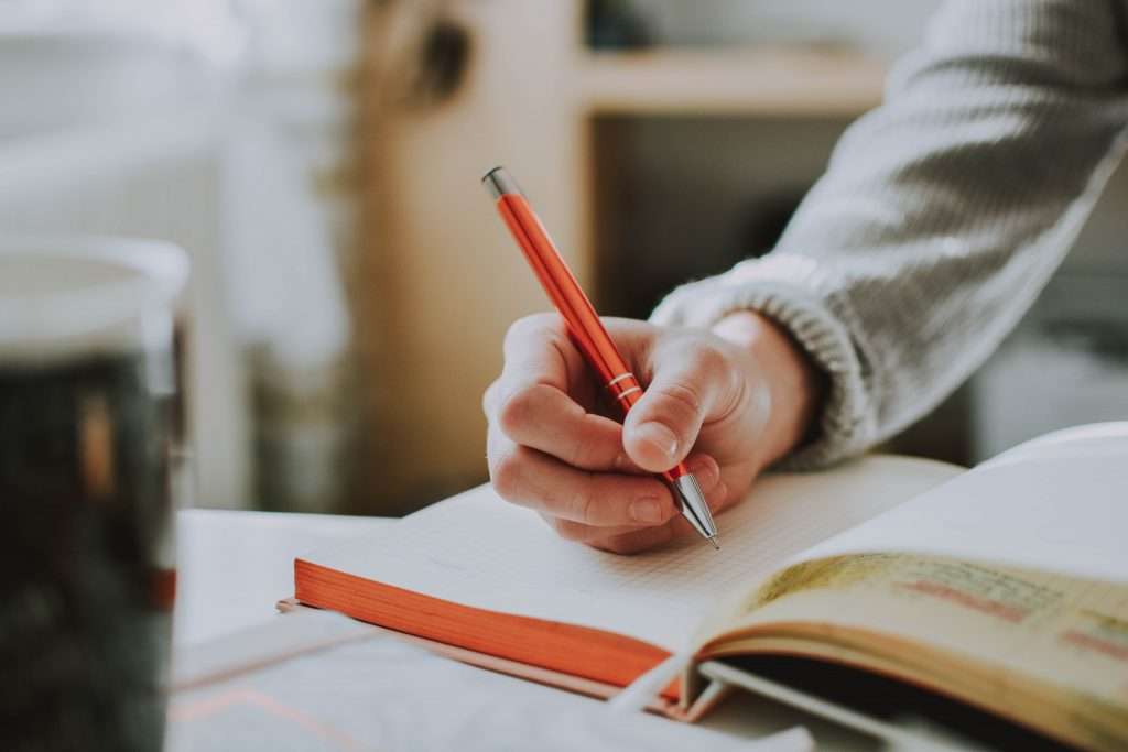 writing in notebook