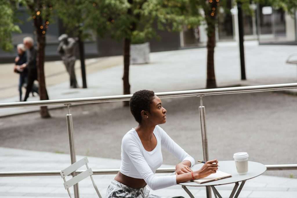 woman writing outside