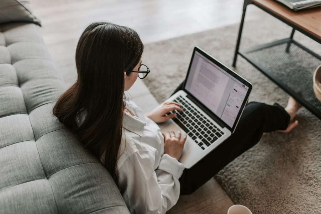 sitting with laptop