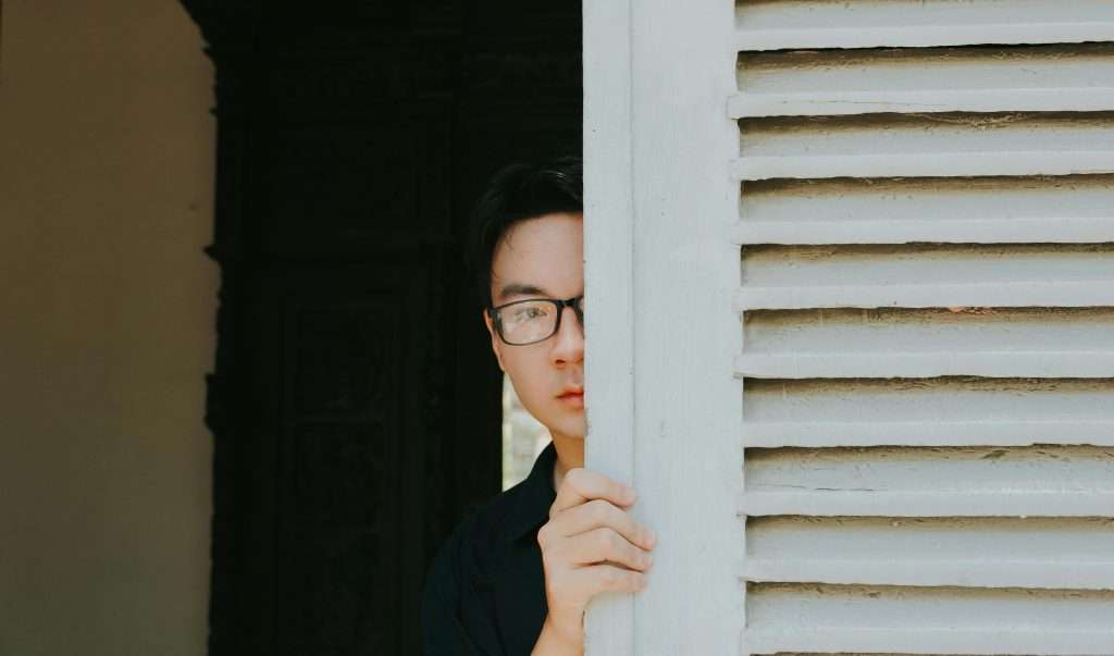 man opening door