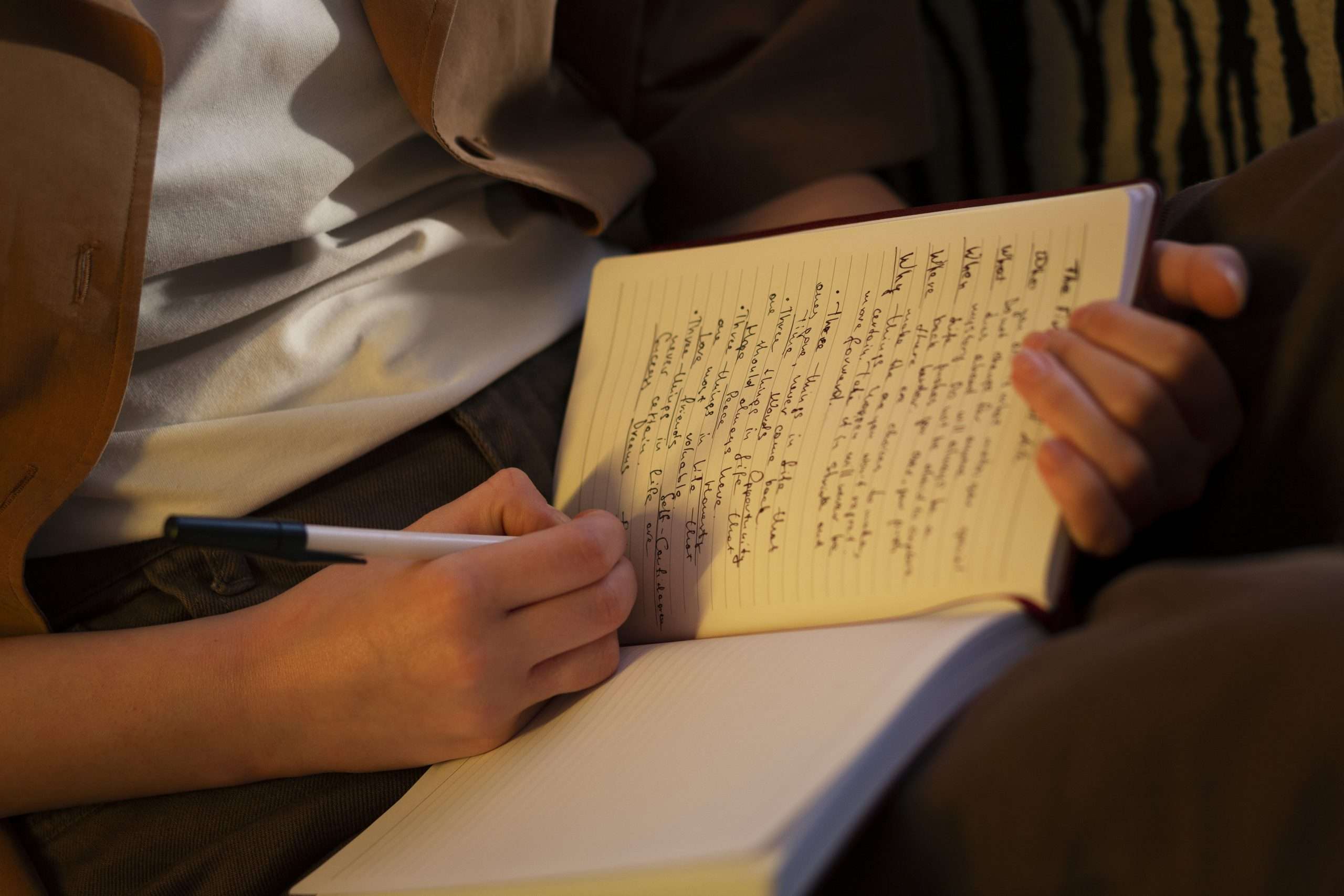 a person writing notes for their story